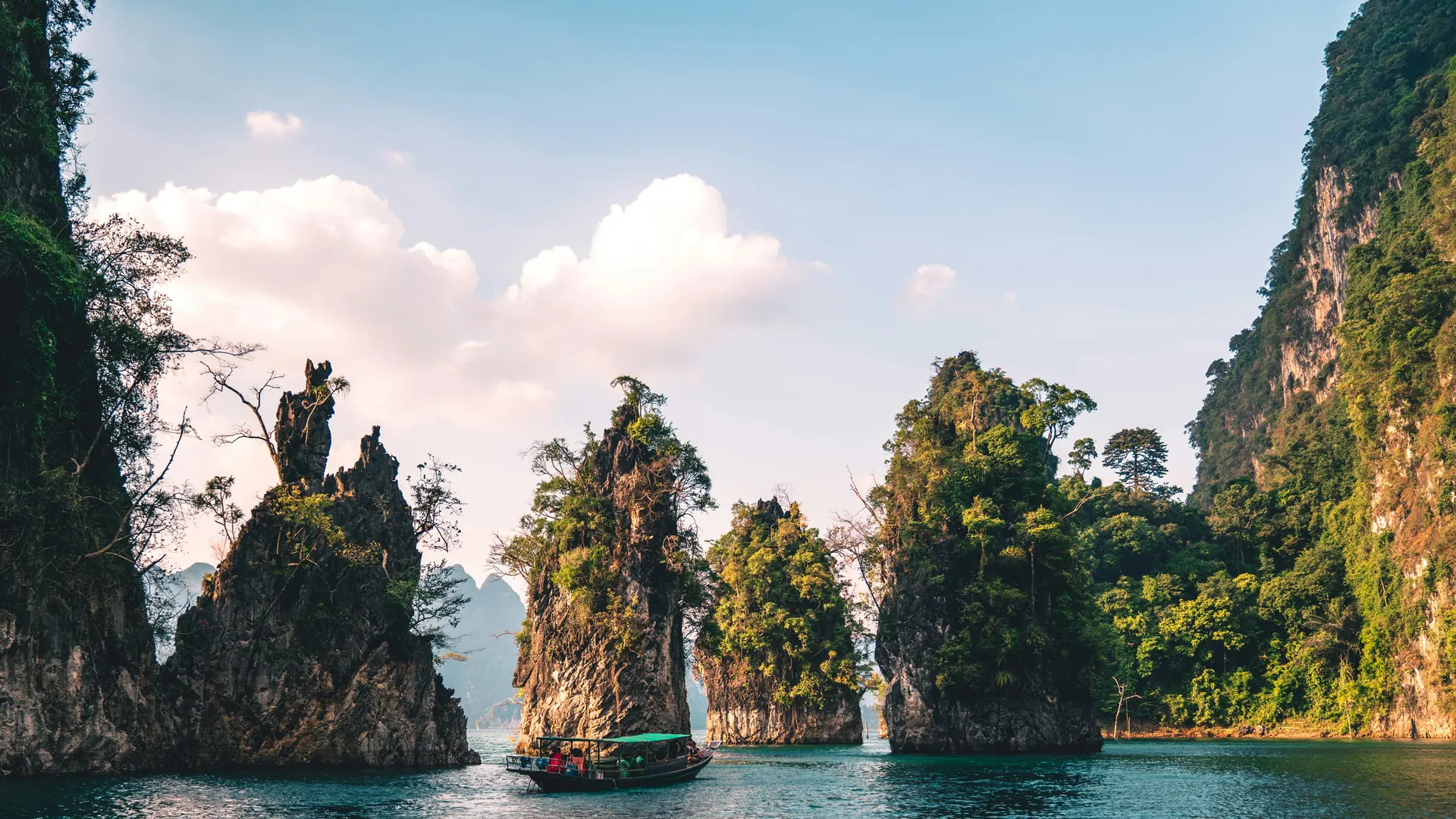 Limestone islands and a traditional boat in Thailand