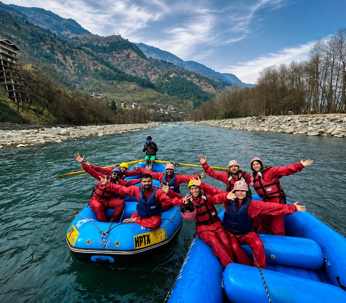 Cross Over Holidays guests river rafting in helmets and life jackets on a Himalayan adventure day